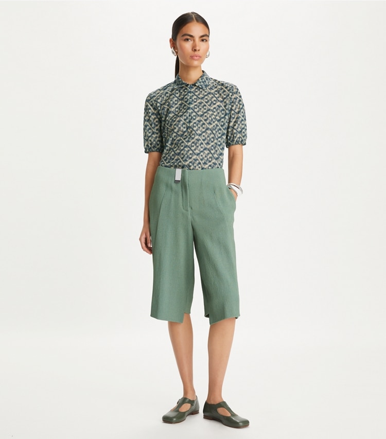 Tory Burch designer tops Prismatic T Monogram Nylon Zip Polo in Smoky Grey Prismatic T Monogram on model front