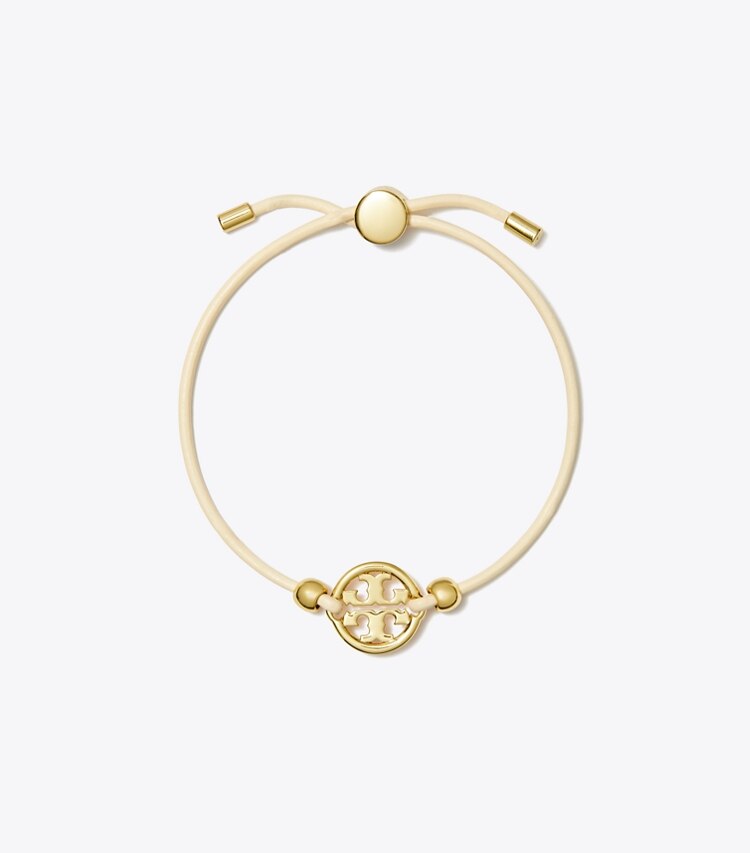 Tory Burch diseñador pulseras Pulsera deslizante Icon en Tory Gold / Ivory frontal