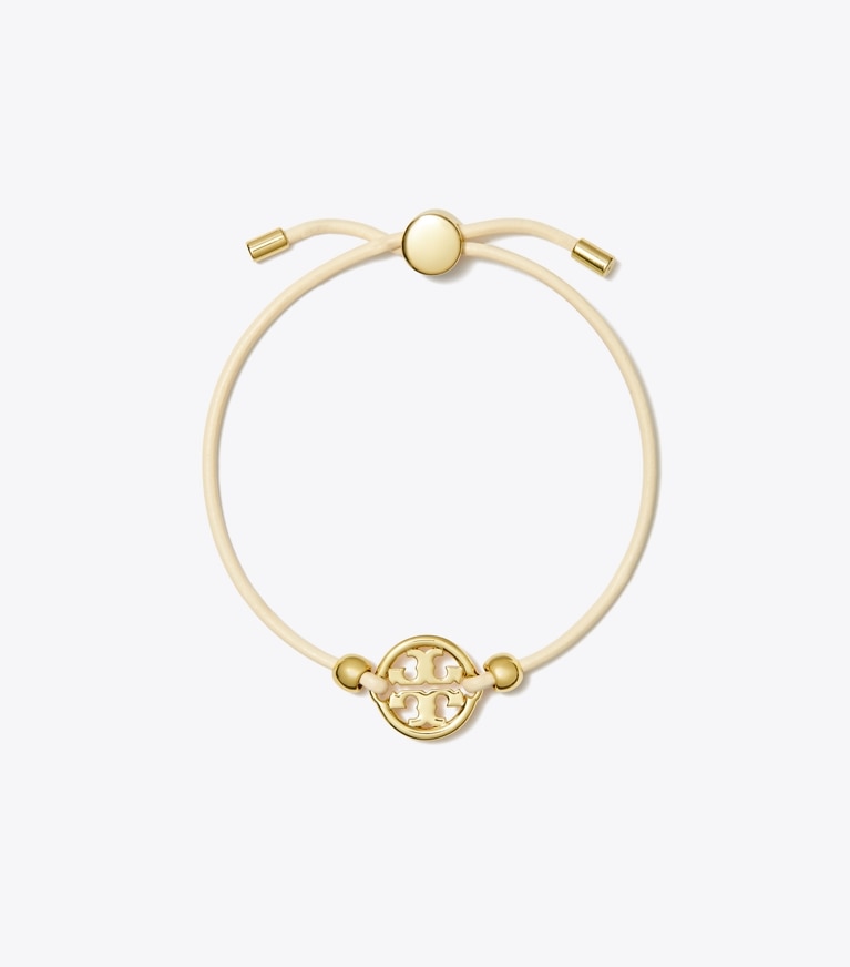 Tory Burch diseñador pulseras Pulsera deslizante Icon en Tory Gold / Ivory frontal