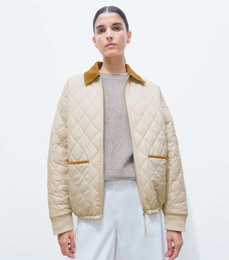 Tory Burch designer jackets Quilted Nylon Jacket in Light Khaki / Terracotta additional on model