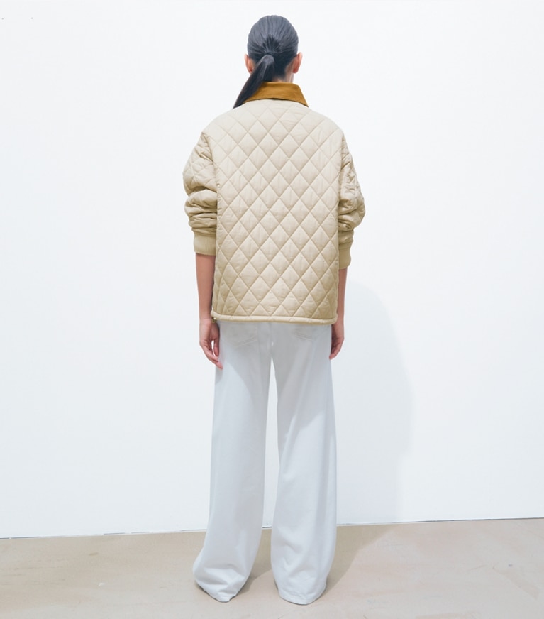 Tory Burch designer jackets Quilted Nylon Jacket in Light Khaki / Terracotta on model back