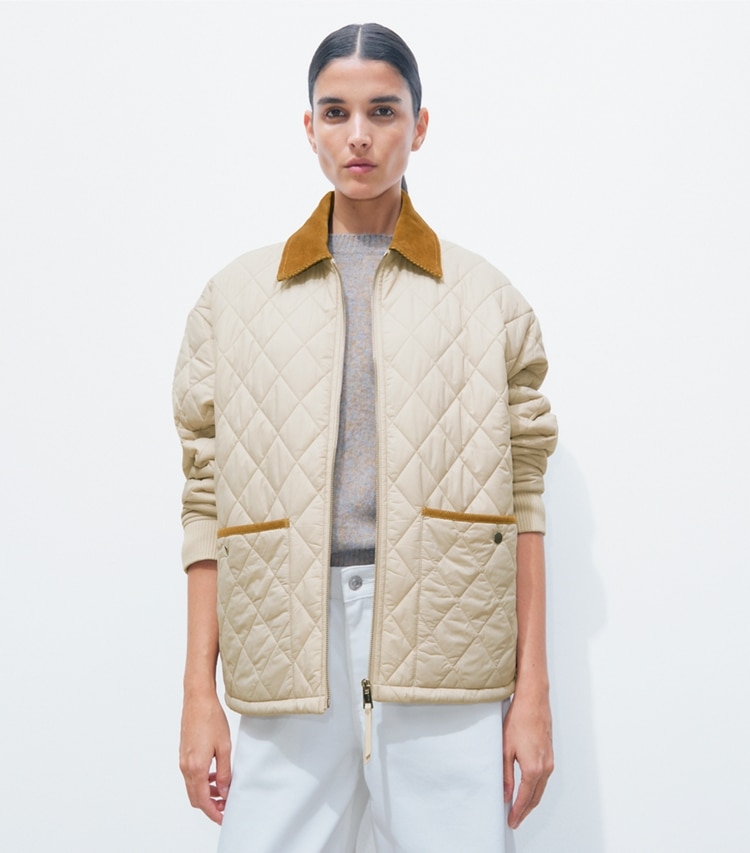Tory Burch designer jackets Quilted Nylon Jacket in Light Khaki / Terracotta on model detail