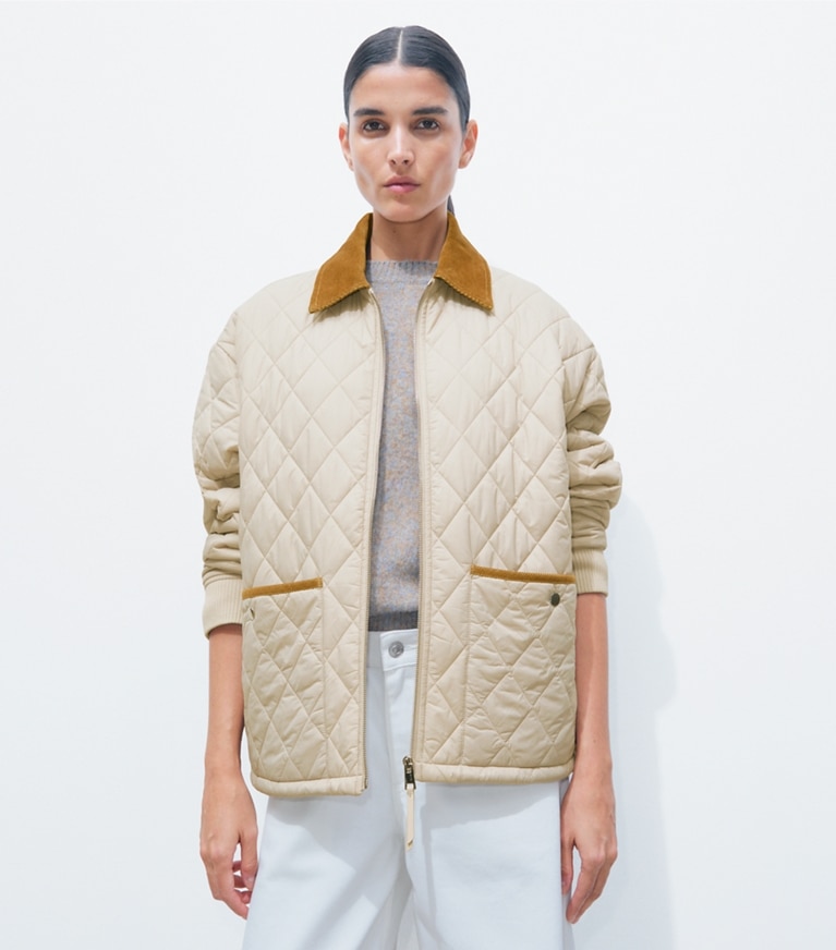 Tory Burch designer jackets Quilted Nylon Jacket in Light Khaki / Terracotta on model detail