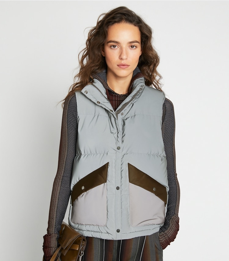 Tory Sport designer coats Reflective Colorblock Down Vest in Reflective Silver on model detail