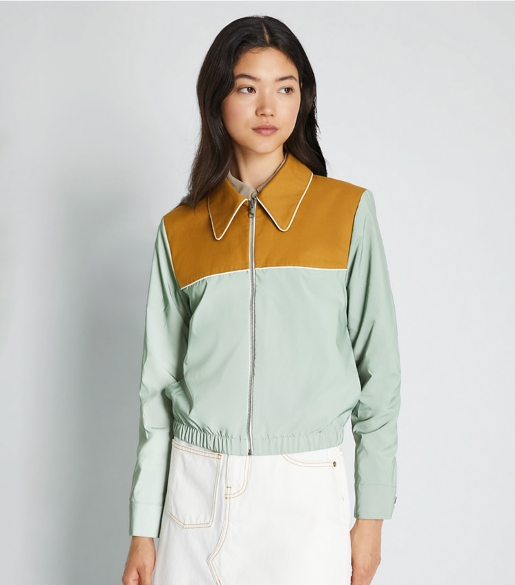 Tory Sport designer jackets Reflective Nylon Jacket in Electric Sage / Ridge on model detail