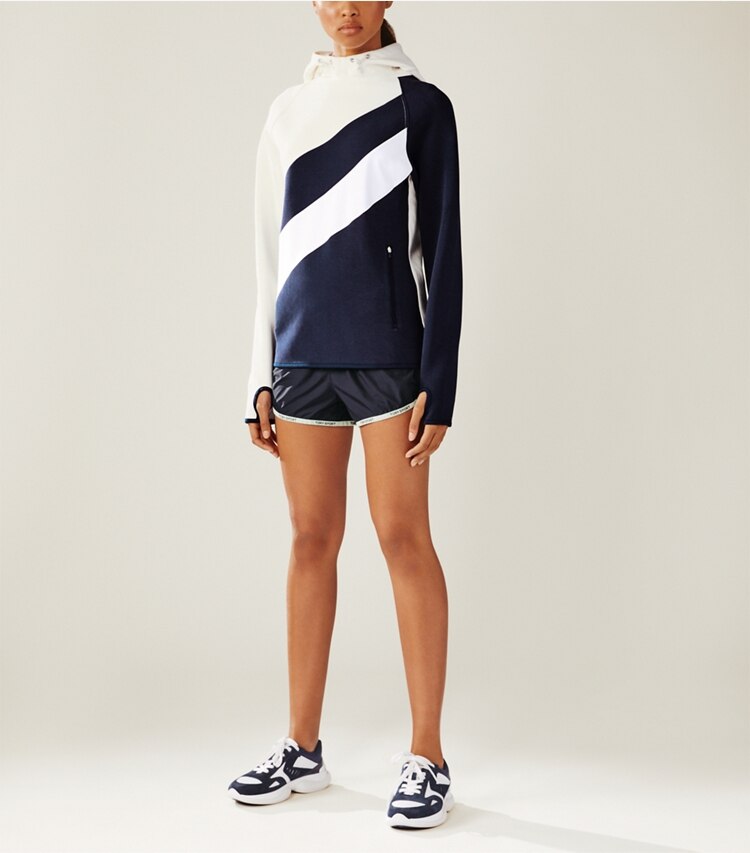 Tory Sport designer sweaters Reflective-Stripe Hoodie in Tory Navy on model front