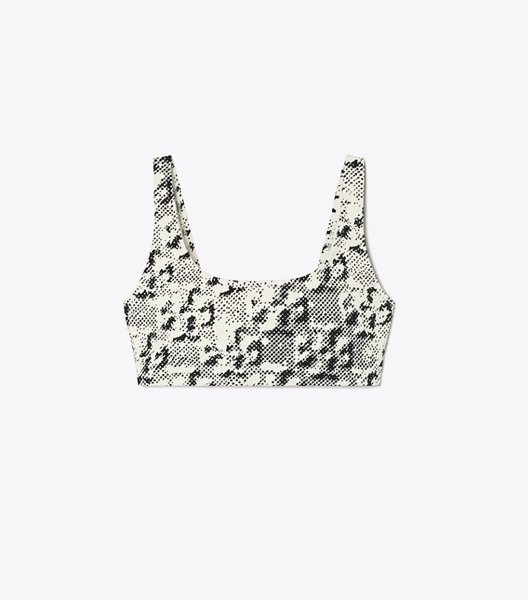 Tory Sport designer reggiseni sportivi Reggiseno con stampa e schiena scoperta in New Ivory Distressed Pixelated Logo front