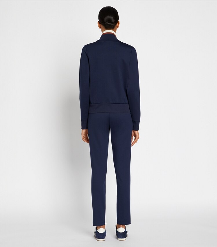 Tory Sport designer bottoms Retroknit Slim Track Pant in Tory Navy on model back