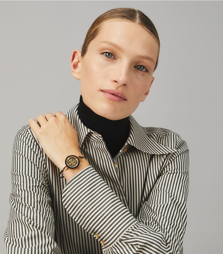 Tory Burch designer strap watches Reva Bangle Watch Gift Set, Black/Gold Stainless Steel/Multi-Color, 29 MM in BLACK/GOLD/MULTI accessory on model