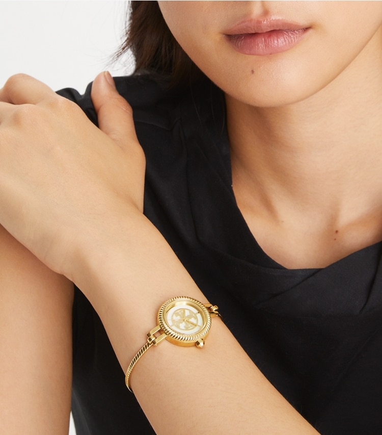 Tory Burch designer strap watches Reva Bangle Watch Gift Set in Gold/Multi-Color accessory on model