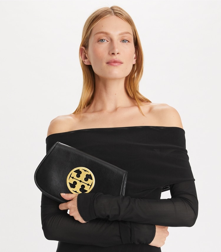 Tory Burch designer clutches Reva Clutch in Black accessory on model