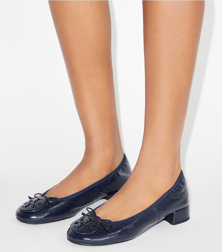 Tory Burch designer flats Reva Heeled Ballet in NEW NAVY / NEW NAVY accessory on model