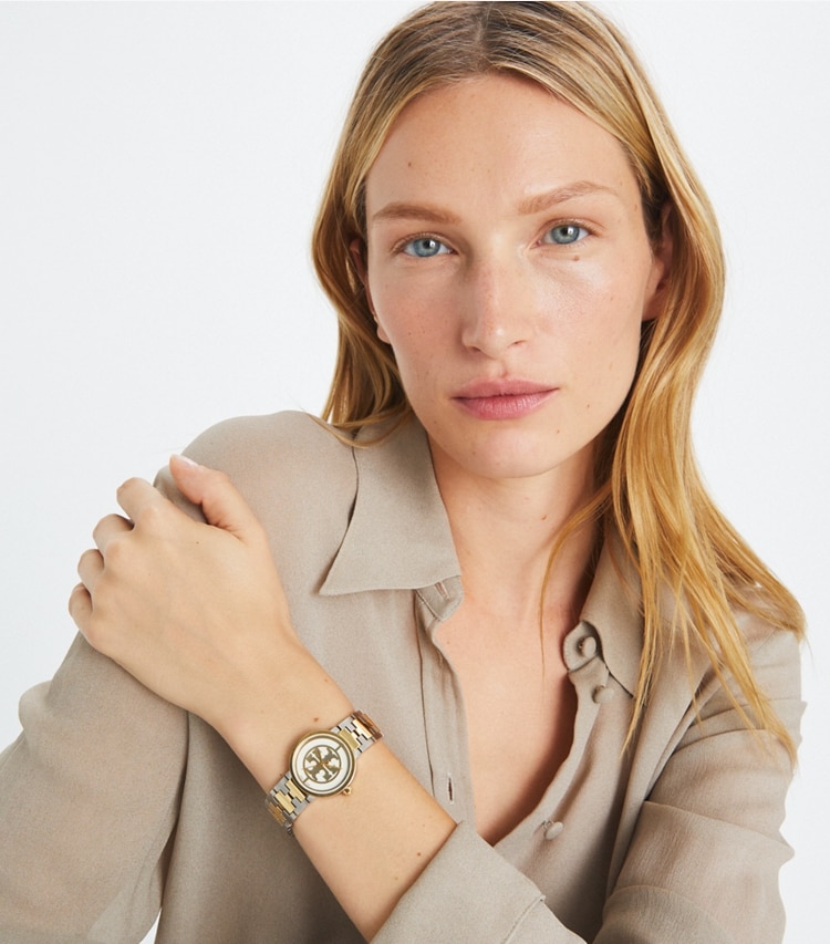Tory Burch designer strap watches Reva Watch, Two-Tone Gold/Stainless Steel/Ivory, 28 MM in Gold/Silver/Ivory accessory on model