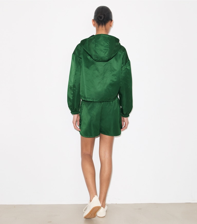 Tory Burch designer jackets Reversible Cropped Nylon Jacket in Dark Green / Navy on model back