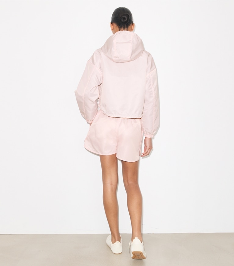 Tory Burch designer jackets Reversible Cropped Nylon Jacket in Rose / Dark Bordeaux on model back