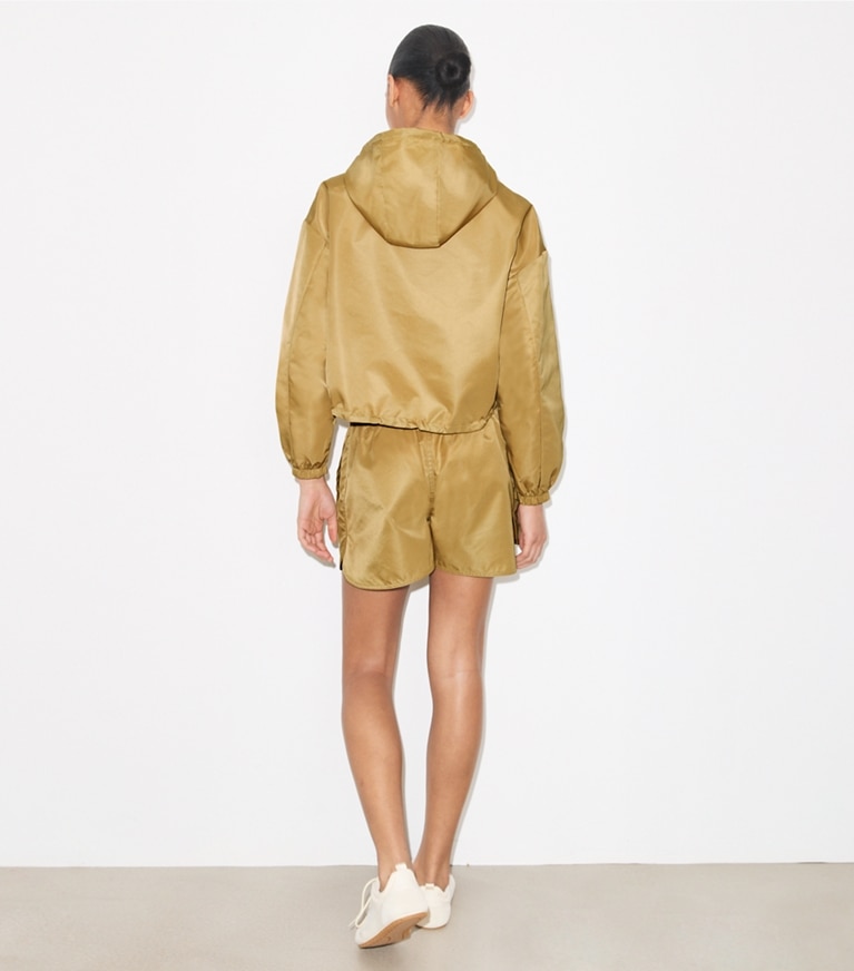 Tory Burch designer jackets Reversible Cropped Nylon Jacket in Green / Lemon on model back