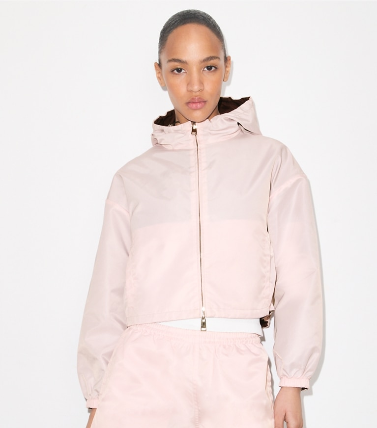 Tory Burch designer jackets Reversible Cropped Nylon Jacket in Rose / Dark Bordeaux on model detail