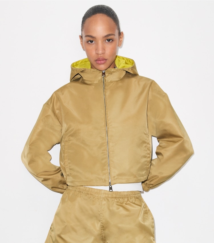 Tory Burch designer jackets Reversible Cropped Nylon Jacket in Green / Lemon on model detail