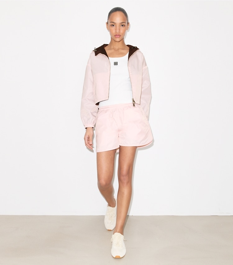 Tory Burch designer jackets Reversible Cropped Nylon Jacket in Rose / Dark Bordeaux on model front