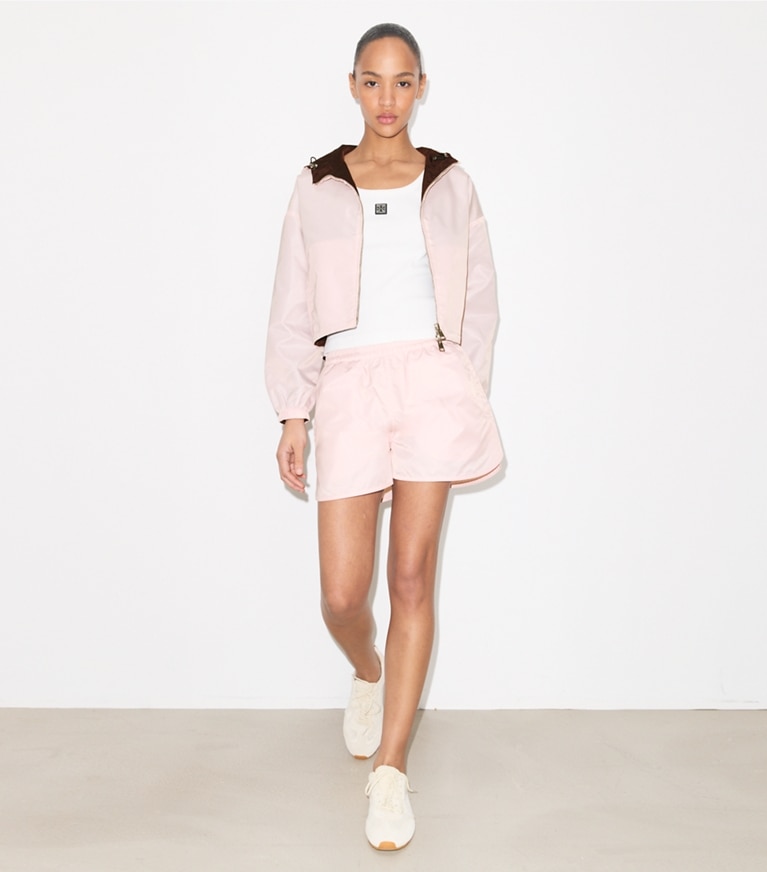 Tory Burch designer jackets Reversible Cropped Nylon Jacket in Rose / Dark Bordeaux on model front