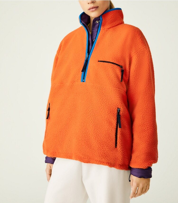 Tory Sport designer coats Reversible Nylon Fleece Pullover Jacket in Eggplant / Poppy Red on model detail