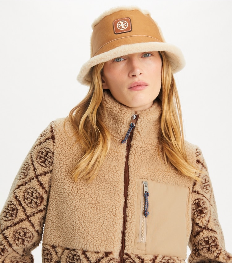 Tory Burch designer hats Reversible Shearling Bucket Hat in Brown / LIGHT NATURAL accessory on model