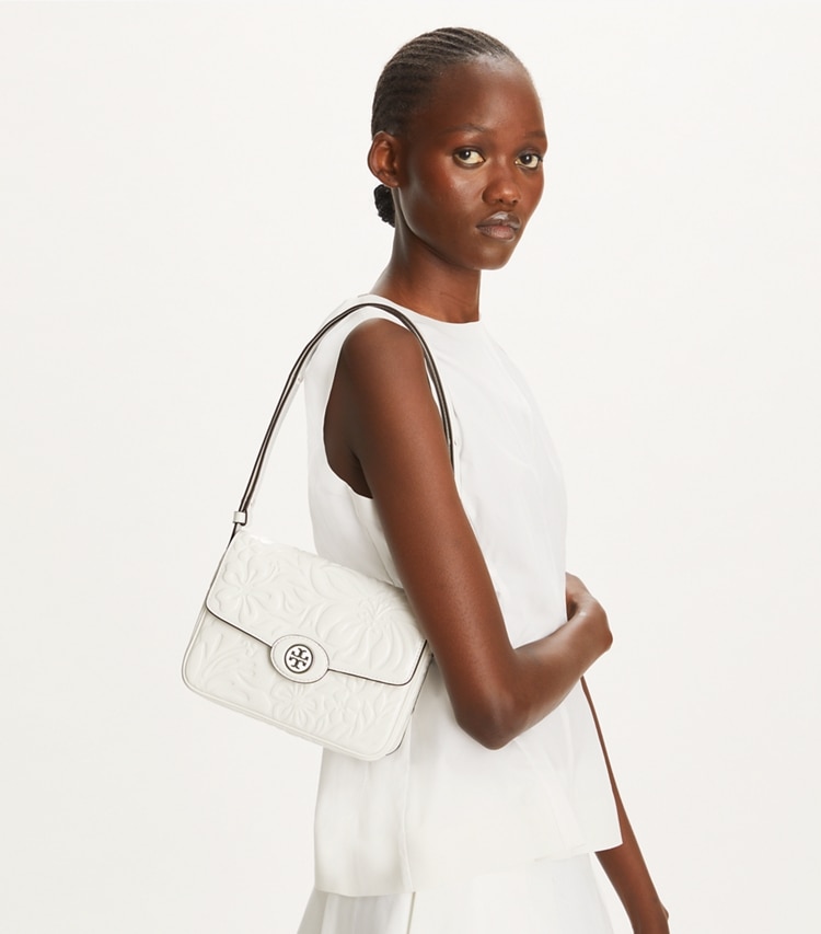 Tory Burch designer shoulder bags Robinson Floral Embossed Convertible Shoulder Bag in Blanc accessory on model