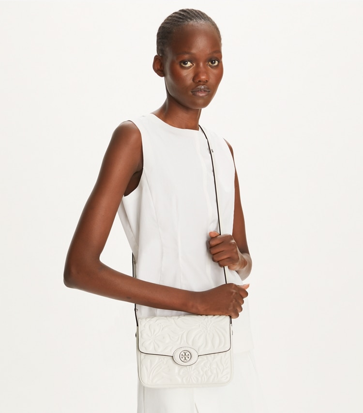 Tory Burch designer shoulder bags Robinson Floral Embossed Convertible Shoulder Bag in Blanc additional on model