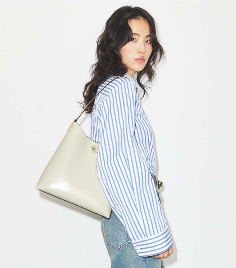 Tory Burch designer hobo bags Robinson Spazzolato Hobo Bag in SHEA BUTTER accessory on model