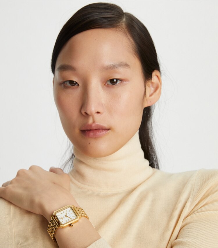 Tory Burch designer strap watches Robinson Watch, Two-Tone Gold/Stainless Steel/Cream, 27 X 29 MM in Gold/Silver accessory on model