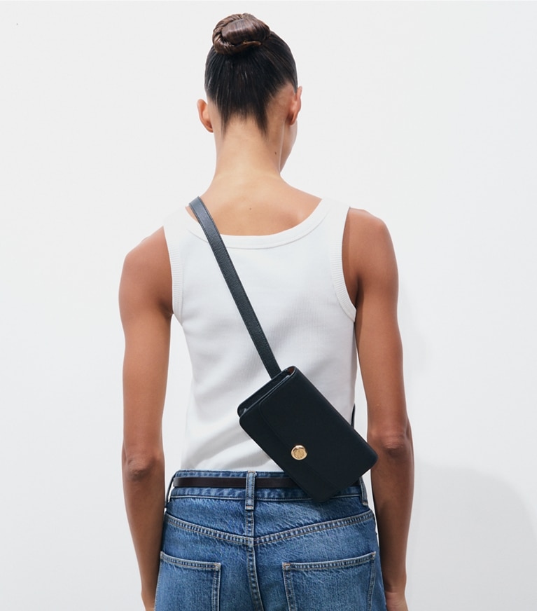 Tory Burch designer belt bags Romy Belt Bag in BLACK accessory on model