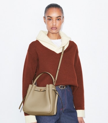 Tory Burch designer crossbody bags Romy Bucket Bag in Soft Cement accessory on model