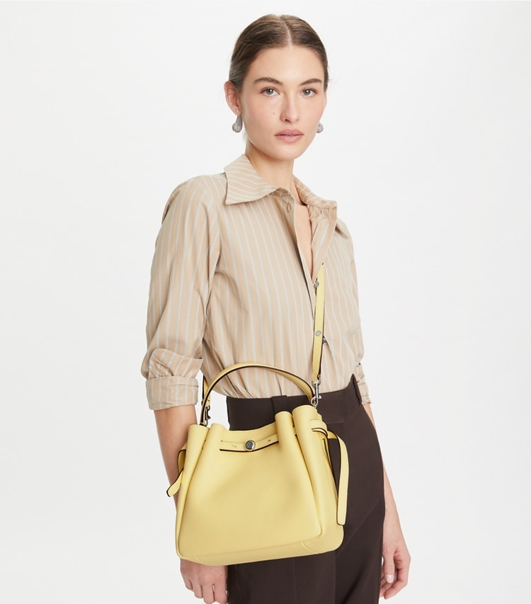 Tory Burch designer crossbody bags Romy Bucket Bag in Lemon accessory on model