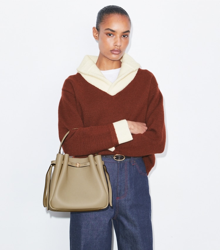 Tory Burch designer crossbody bags Romy Bucket Bag in Soft Cement additional on model