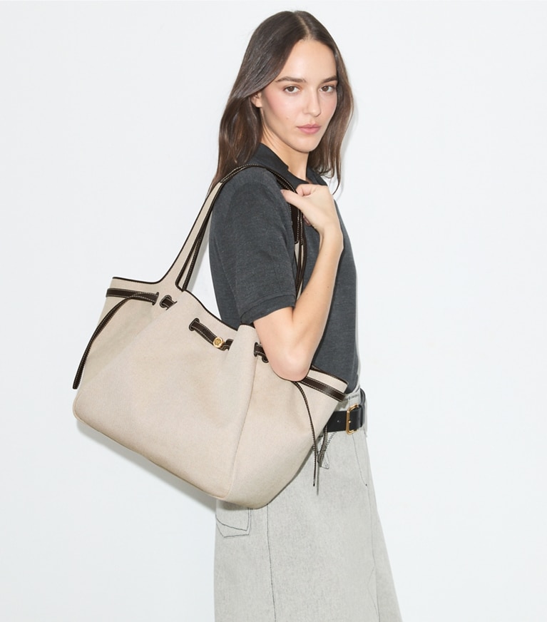Tory Burch designer tote bags Romy Canvas Tote in Dusty Almond/ Bianco White accessory on model