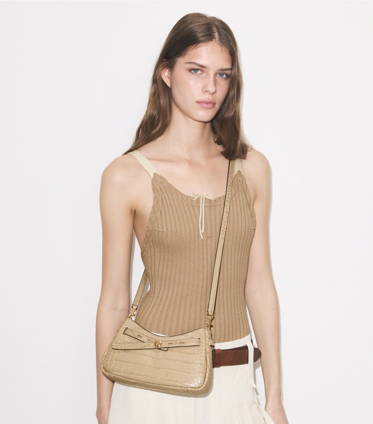 Tory Burch designer crossbody bags Romy Croc-Embossed Zip Top Crossbody Bag in Light Hickory accessory on model
