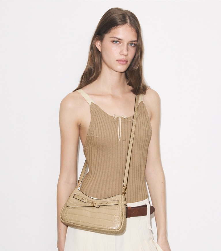 Tory Burch designer crossbody bags Romy Croc-Embossed Zip Top Crossbody Bag in Light Hickory accessory on model