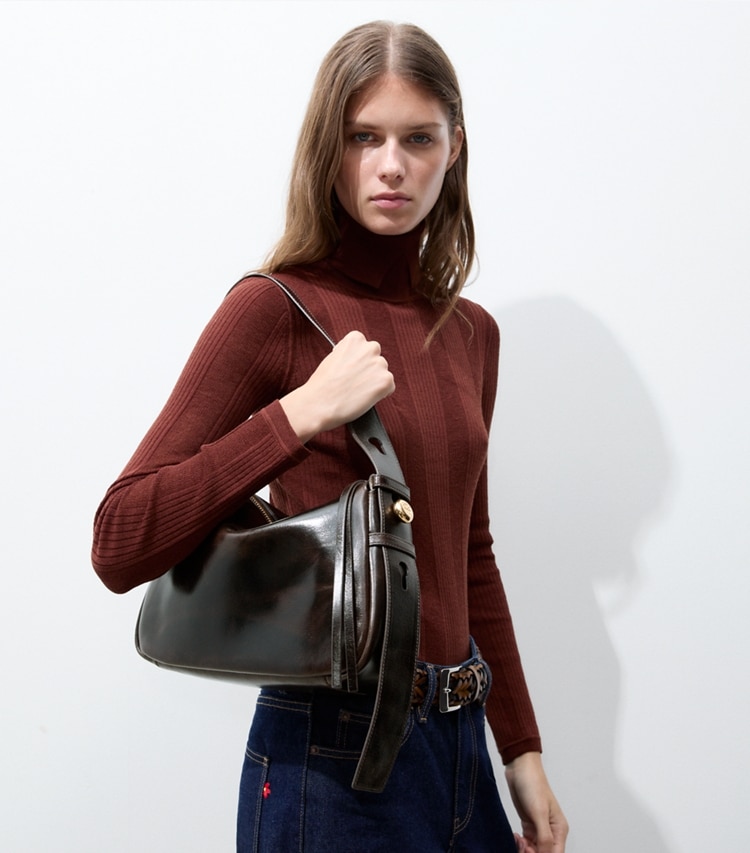 Tory Burch designer shoulder bags Romy Distressed Shoulder Bag in Dark Brown accessory on model