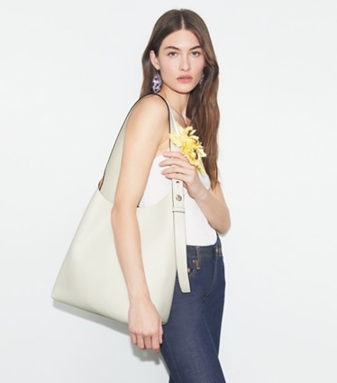 Tory Burch designer hobo bags Romy Hobo Bag in Light Cream accessory on model