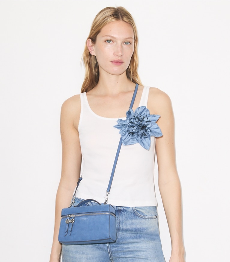 Tory Burch designer crossbody bags Romy Nubuck Slim Top Handle in Soft Blue accessory on model