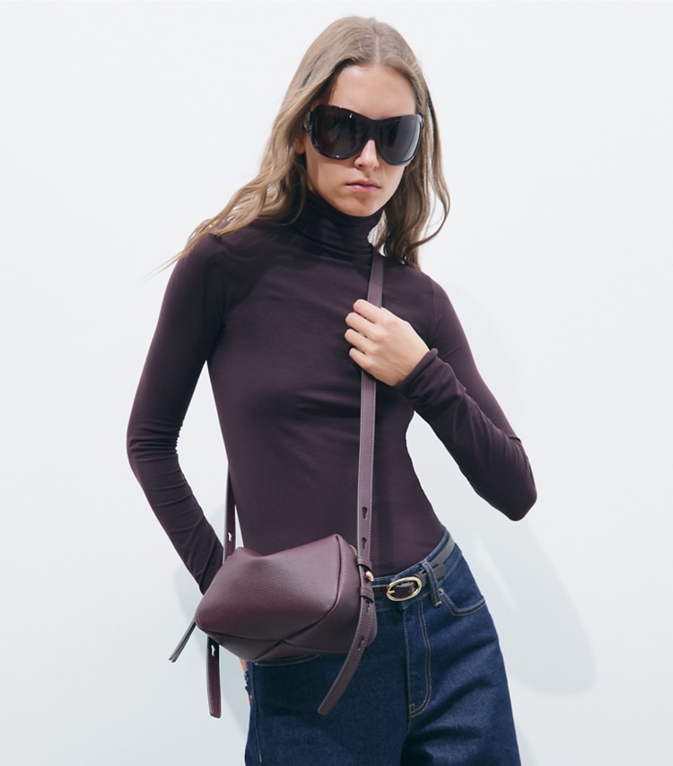 Tory Burch designer crossbody bags Romy Soft Crossbody Bag in Dark Carmine additional on model
