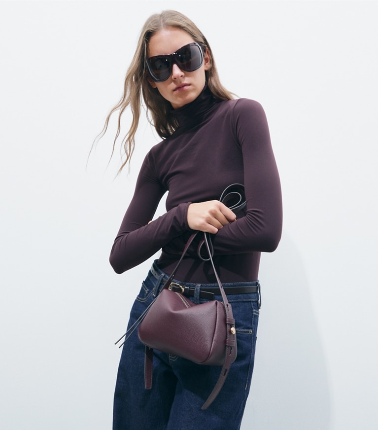Tory Burch designer crossbody bags Romy Soft Crossbody Bag in Dark Carmine additional on model