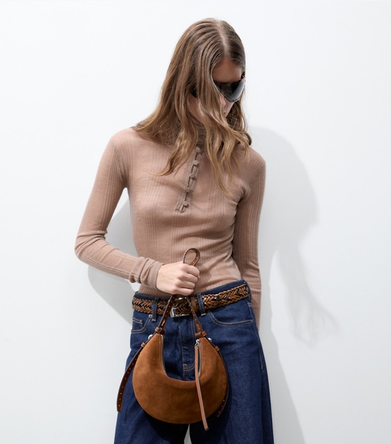 Tory Burch designer shoulder bags Romy Studded Suede Half Moon Bag in Caramel additional on model