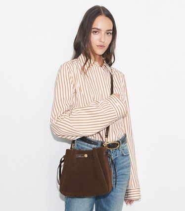 Tory Burch designer crossbody bags Romy Suede Bucket Bag in Dark Cocoa accessory on model