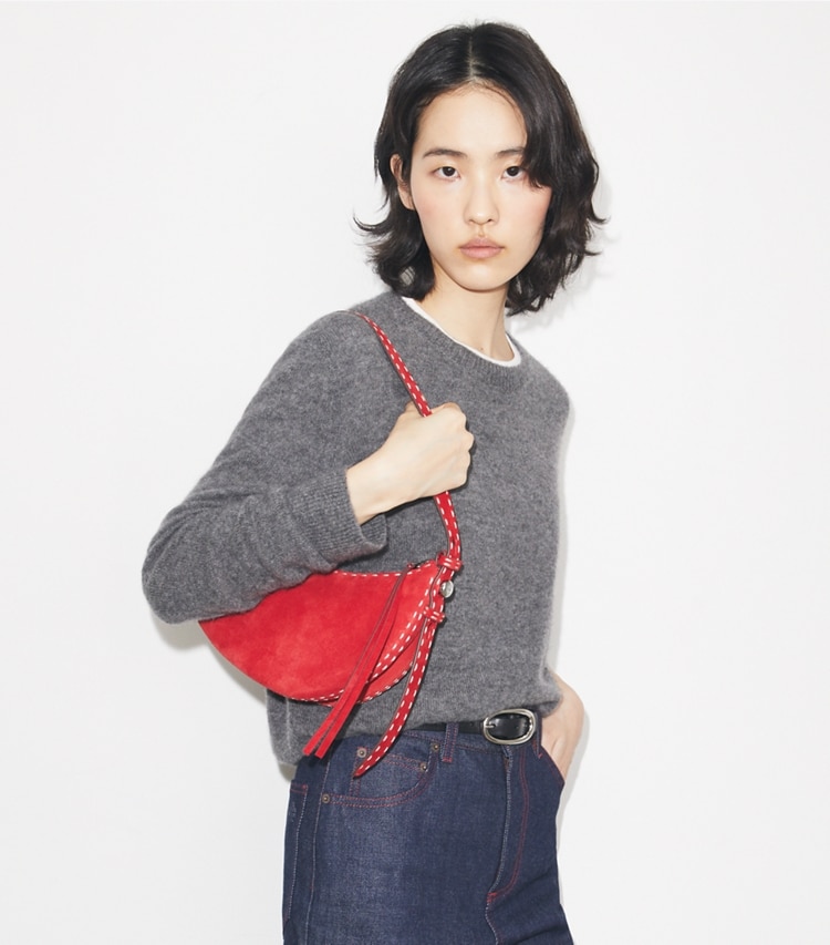 Tory Burch designer shoulder bags Romy Suede Half Moon Bag in Toucan Red accessory on model