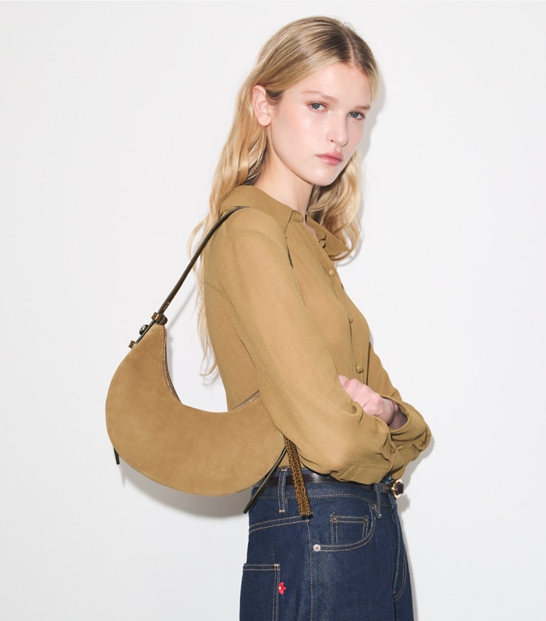 Tory Burch designer shoulder bags Romy Suede Half Moon Bag in Stone additional on model