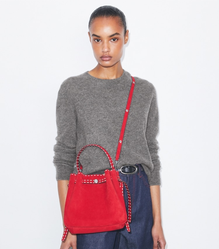 Tory Burch designer crossbody bags Romy Suede Pick Stitch Bucket Bag in Toucan Red additional on model