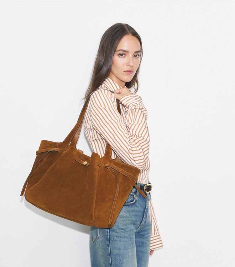 Tory Burch designer tote bags Romy Suede Tote in Park Bench accessory on model