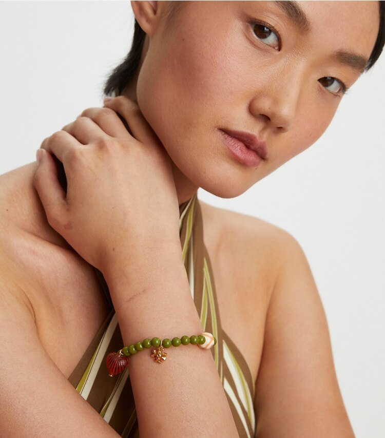 Tory Burch designer bracelets Roxanne Beaded Tassel Bracelet in Rolled Tory Gold / Green accessory on model