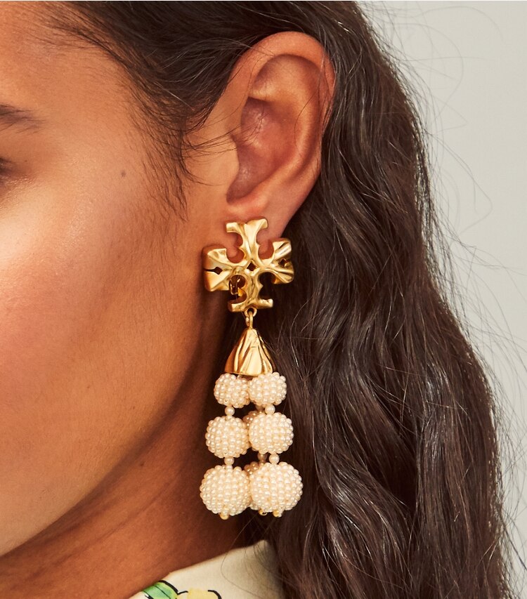 Tory Burch designer earrings Roxanne Beaded Tassel Earring in Rolled Brass/Ivory/Cream accessory on model
